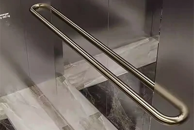 Elevator interiors, elevator buttons, and handrails