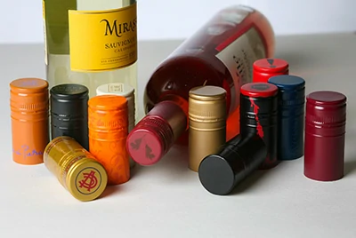 wine bottles with different foil capsule styles and colors