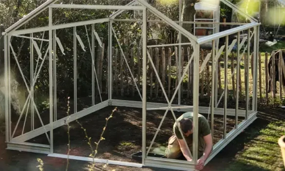 Aluminum greenhouse kit with frame, panels, doors, vents, gutters, and installation accessories