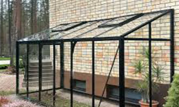 Lean-to aluminum greenhouse with aluminum frame connected to building wall