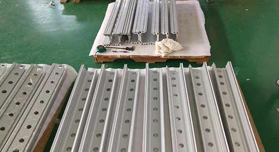 Drilled aluminum greenhouse frame parts with mounting holes for easy installation