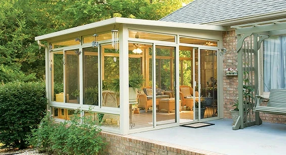 Three season aluminum sunroom with glass panels and sliding doors