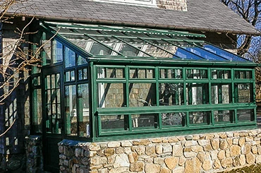Single slope aluminum sunroom roof for wall attached patio enclosure