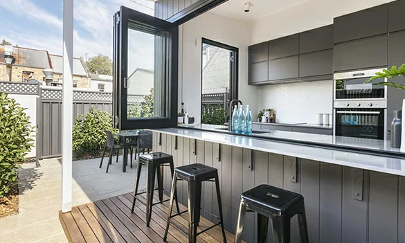Aluminum bifold window for outdoor bar counter and backyard entertainment area